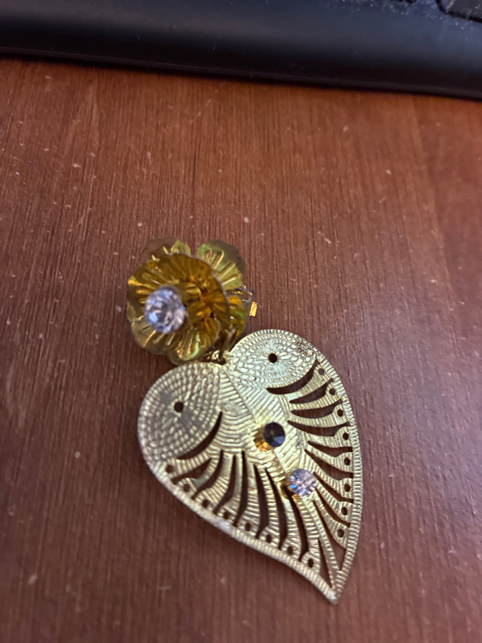 Submitted photo of Gold-tone filigree heart and flower costume jewelry earring