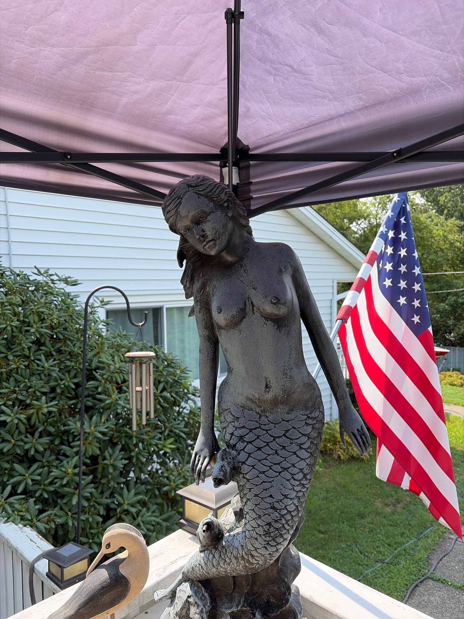 Submitted photo of Cast metal mermaid sculpture