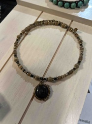 Multi-Strand Beaded Bracelet with Black Cabochon Pendant