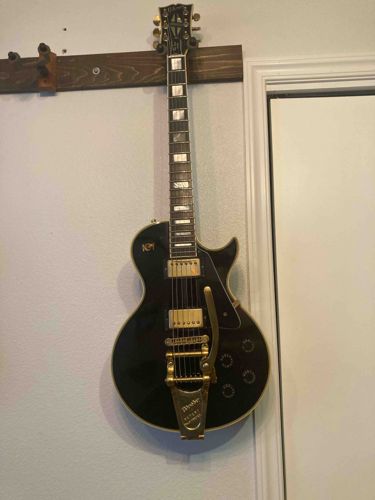 Black Electric Guitar with Bigsby Vibrato