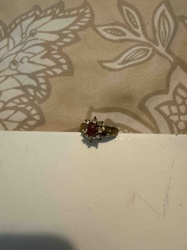 Gold-Toned Ring with Red Center Stone and Clear Accent Stones