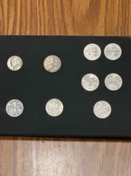 Assorted Coin Collection on Black Display