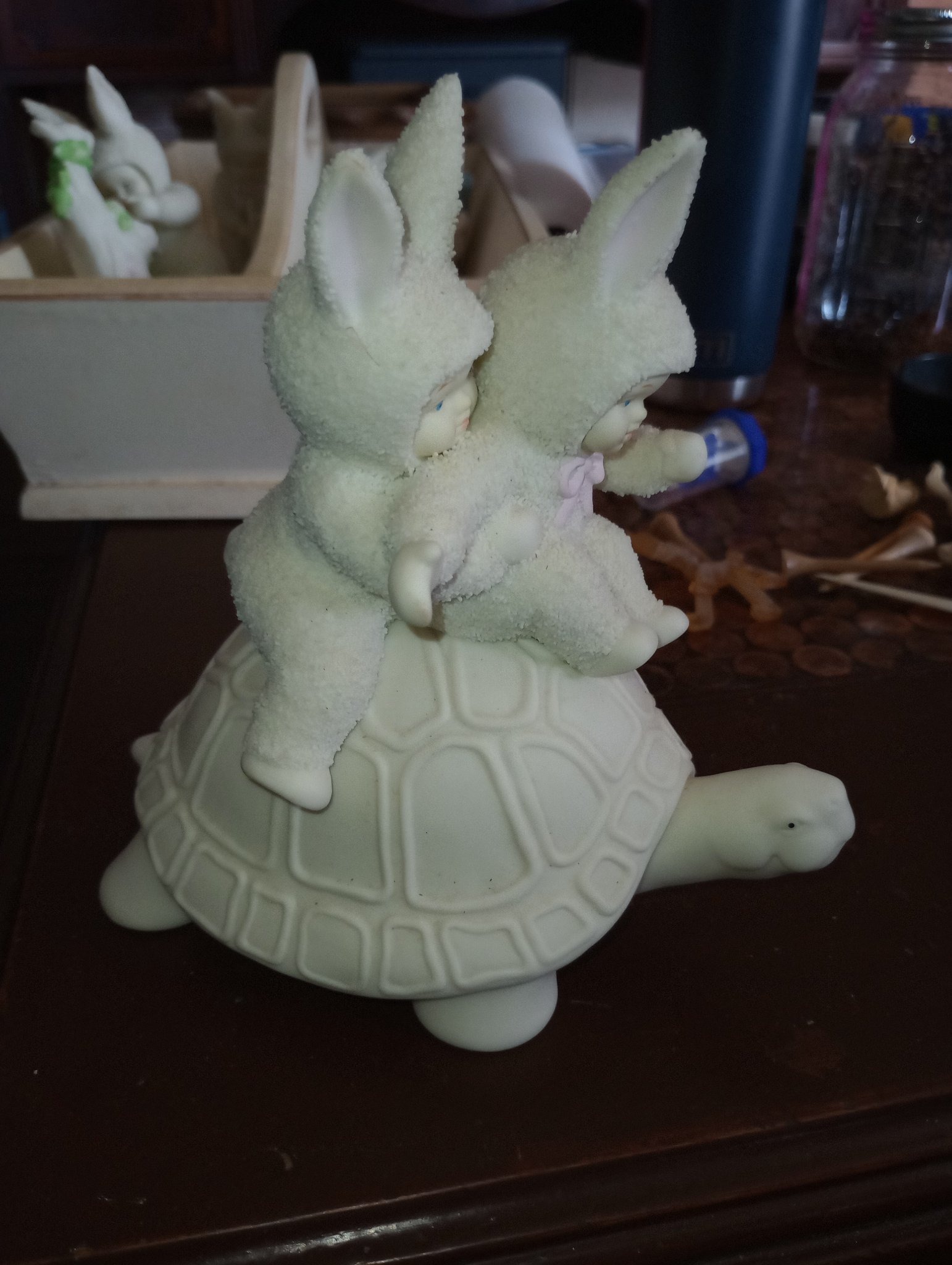 Submitted photo of Porcelain figurine featuring children in rabbit costumes riding a turtle