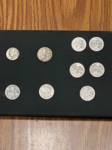 Assorted Coin Collection on Black Display