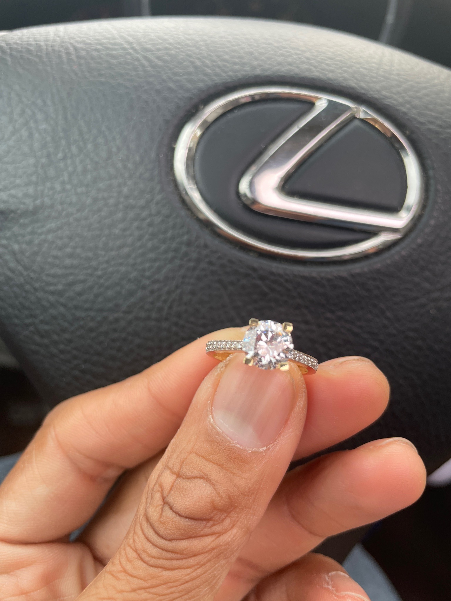 Submitted photo of Diamond Solitaire Ring with Pave Band (unauthenticated)