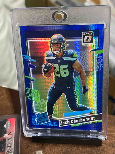 2023 Donruss Optic Zach Charbonnet Rated Rookie Blue Velocity Prizm