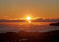 Sunset/Sunrise over Water with Atmospheric Optical Effect