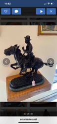 Bronze Tone Sculpture of a Cowboy on Horseback