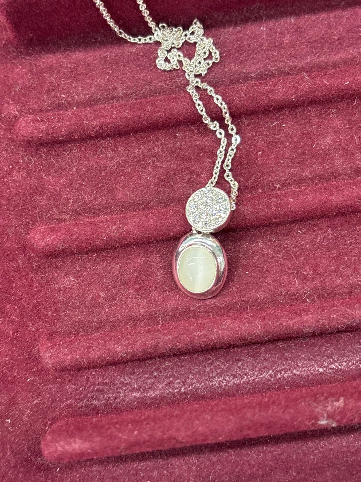 Submitted photo of Silver-tone pendant necklace with pavé and cabochon stone