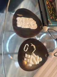 Two Carved Shell and Ivory Pendants