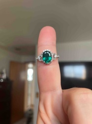 Oval Emerald and Diamond Halo Ring