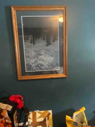 Framed Print of Wild Animals in Snow Landscape