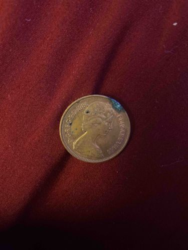 1985 British or Commonwealth Coin featuring Queen Elizabeth II (drilled)