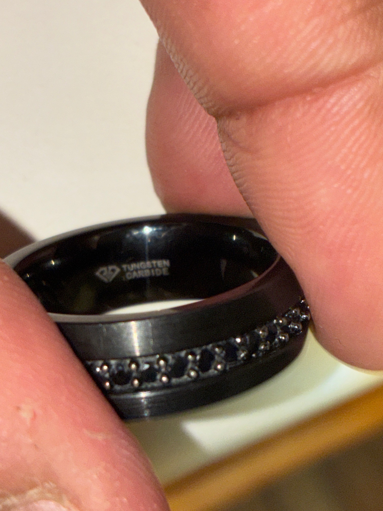 Submitted photo of Tungsten carbide band with black stones (unauthenticated)