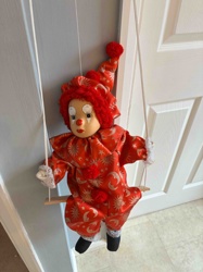 Clown Doll on Wooden Swing