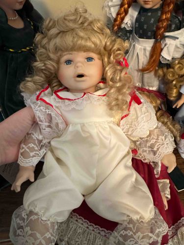 Blonde Porcelain Doll in White Romper