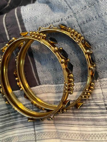 Pair of Gilt Metal or Brass Bangles with Black Stone Inlays