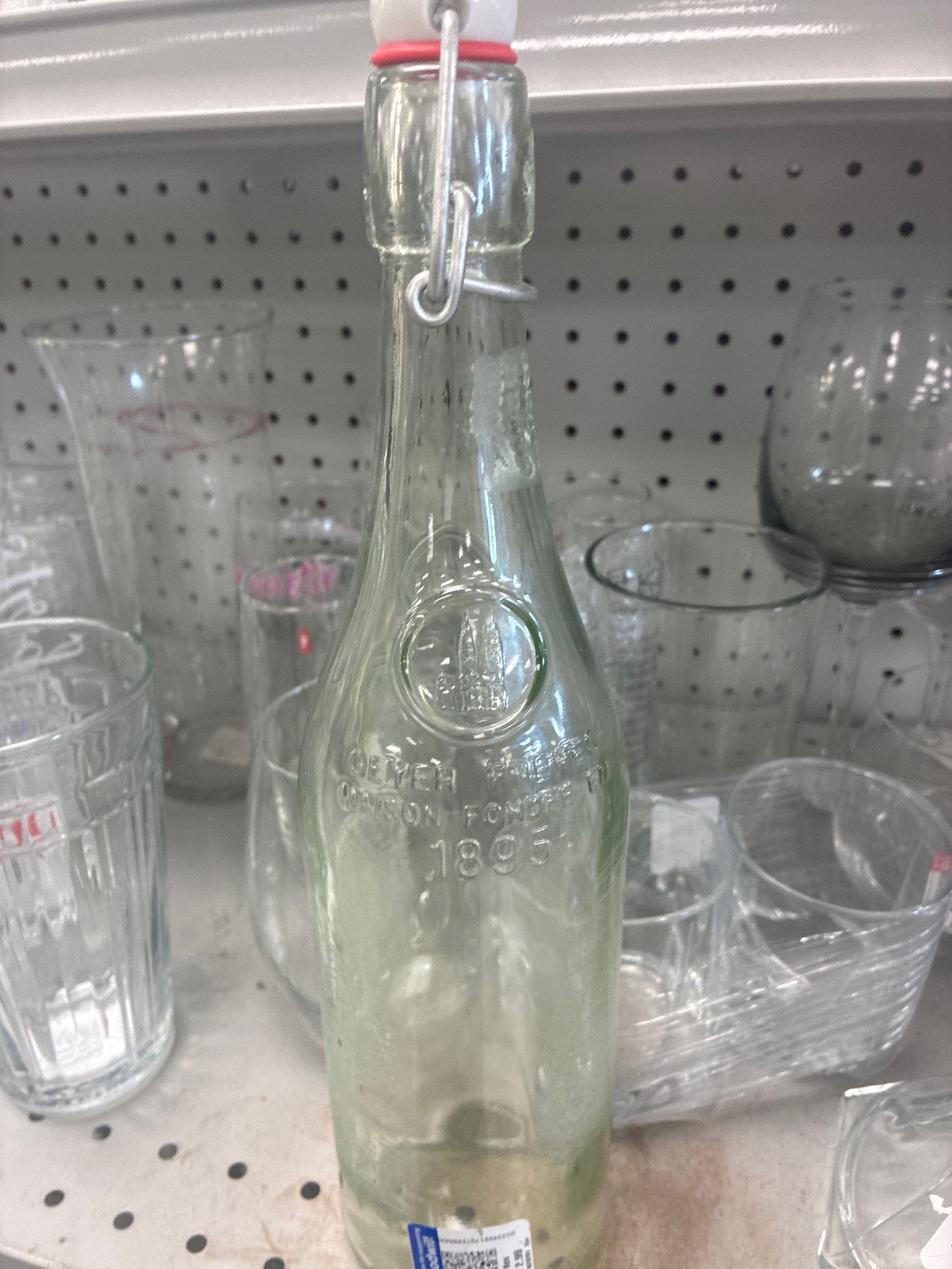 Submitted photo of Clear glass swing-top bottle bearing embossed text reading 'GEYER MAISON FONDEE EN 1895'