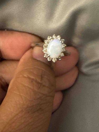 Oval Opal and Diamond Halo Ring