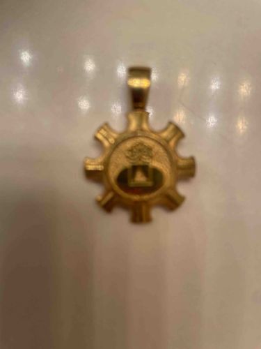 Gear-Shaped Emblematic Pendant with Tree and Pyramid Motif