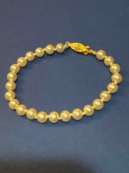 Pearl Bracelet with Ornate Gold-Tone Clasp