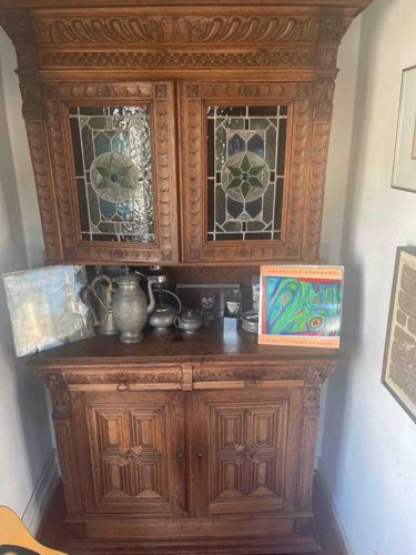 Carved Oak Display Cabinet with Stained Glass Panels