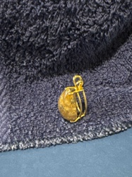 Gold-Toned Teardrop Pendant with Included Stone (Rutilated Quartz type)