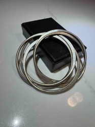 Set of Four Silver-Toned Bangle Bracelets