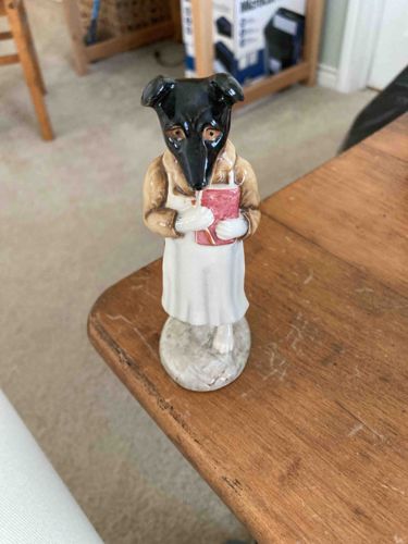 Anthropomorphic Dog Figure Holding a Book