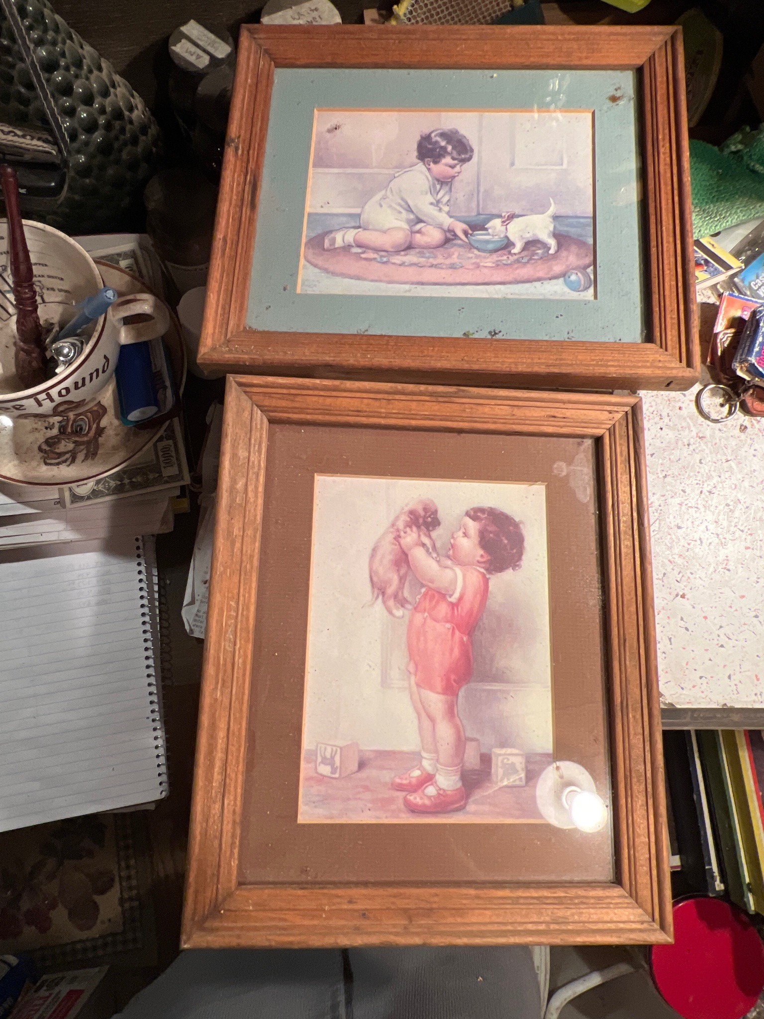 Submitted photo of Framed vintage prints depicting children with pets