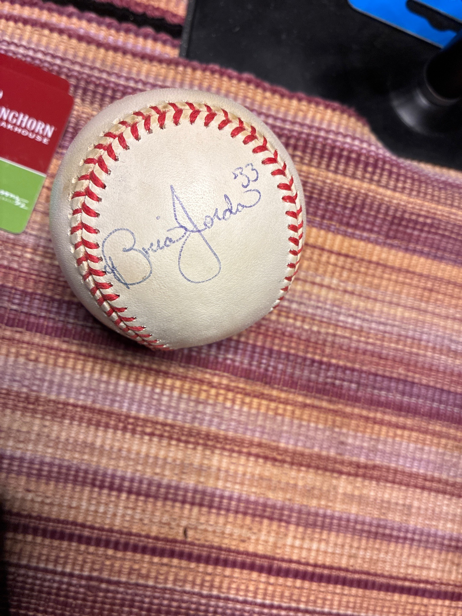 Submitted photo of Baseball signed "Brian Jordan 33"
