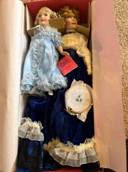 Two Porcelain Dolls with Accessories in Original Box